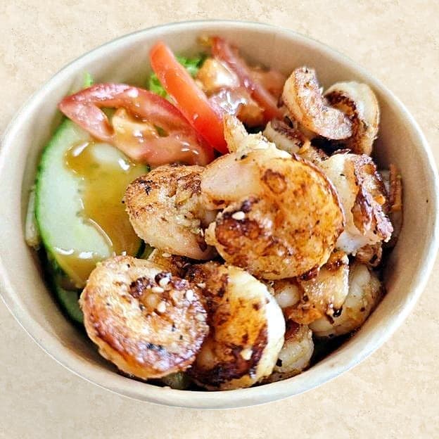 Hibachi chicken and shrimp plate with fried rice and vegetables